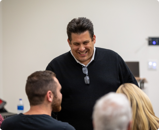 DMC70017 1 Man smiling at class